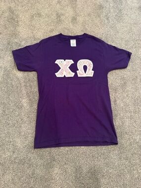 Purple multicolored dot chi omega letters